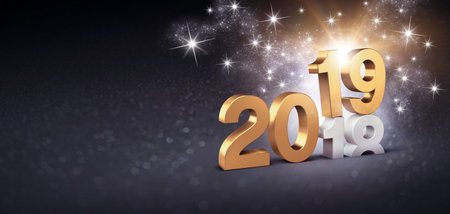 New Year date number 2019 colored in gold, above ending year 2018, glittering on a festive black...