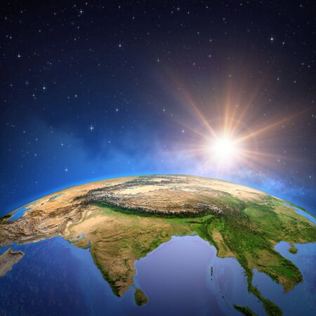 Surface of the Planet Earth viewed from a satellite, focused on East Asia, sun rising on the horizon. Physical map of Himalayas mountains, India and China. 3D illustrationの写真素材