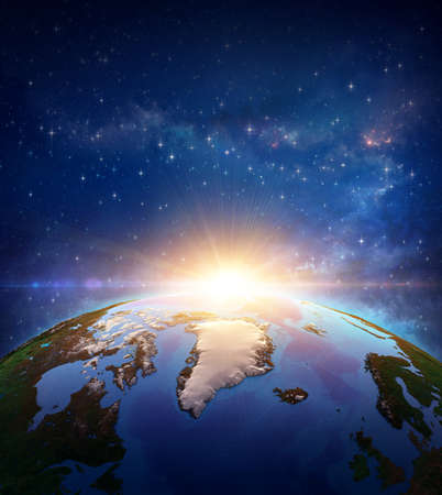Surface of Planet Earth viewed from a satellite, focused on North Pole and Arctic Ocean, sun rising on the horizon. Ice melting and global warming on Greenland. 3D illustration -の写真素材