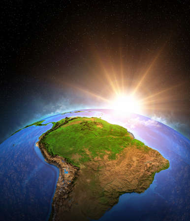 Warm sun shining over Planet Earth, focused on South America. Global warming on Amazon rainforest and Brazil. 3D illustrationの素材 [FY310168155265]