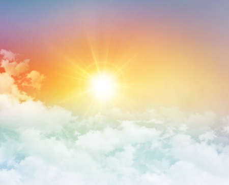Rising sun in the morning colorful sky with white low clouds, on a clear new day in Heavenの写真素材