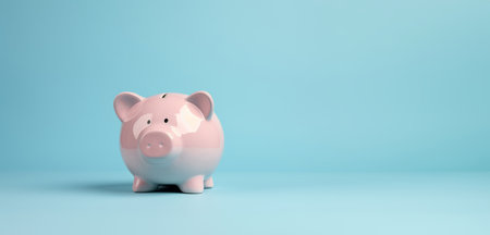 Pink pig piggy bank isolated on blue background - Generative AIの素材