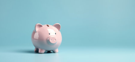 Pink pig piggy bank isolated on blue background - Generative AIの素材