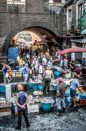 Catania, Italy - July 29, 2013: Old fish market of Catania in the crowded square Alonzo di Benedetto.のeditorial素材