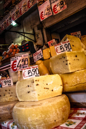 Various cheeses for sale at a market in Catania, Sicily.