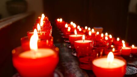 Red Votive Candles in a Churchの写真素材