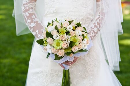 bridal bouquet  in the the bride's handsの写真素材
