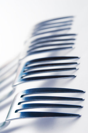 Several forks on a white background