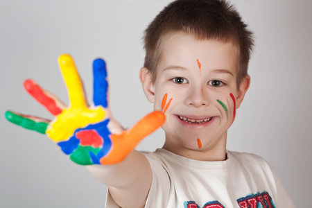 child showing his colored hands