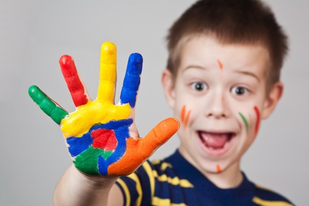 child showing his colored handsの写真素材