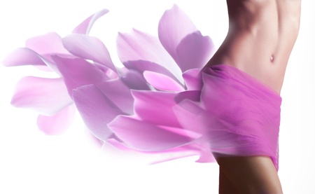 Beautiful woman with petals  on her hipsの写真素材
