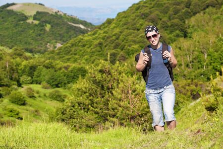 tourism. young girl woman hiking in the mountainsの写真素材
