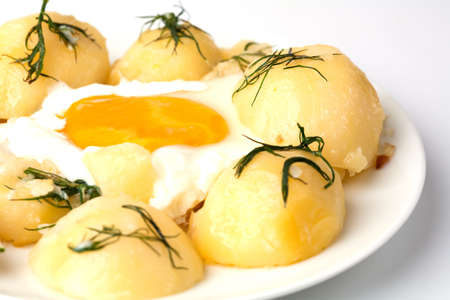 food  Young potatoes with fried eggsの写真素材