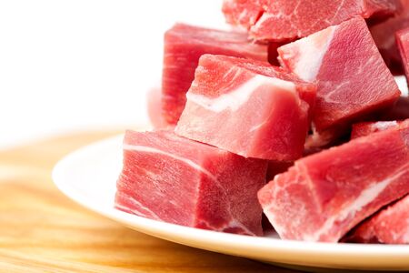 pieces of frozen meat isolated on a white backgroundの写真素材