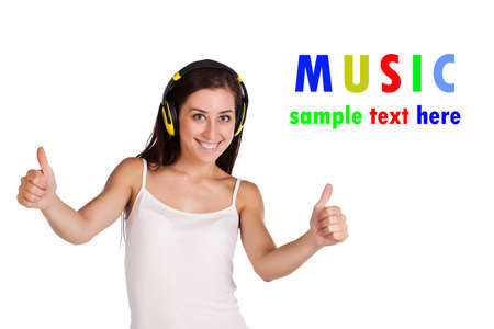 young attracive girl is listening music on headphones   isolatedの写真素材