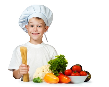 cute boy Chef is holding raw spaghetti  isolatedの写真素材