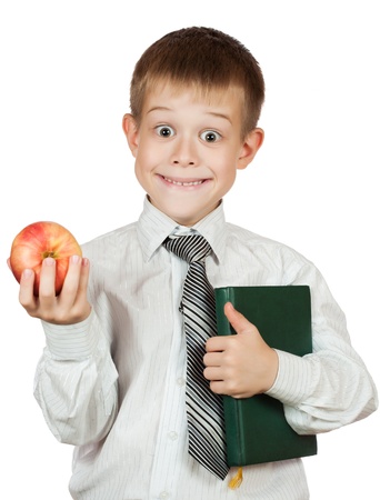 Cute student is holding book and apple  isolatedの写真素材