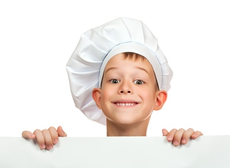 cook boy is hiding behind a white sheetの写真素材