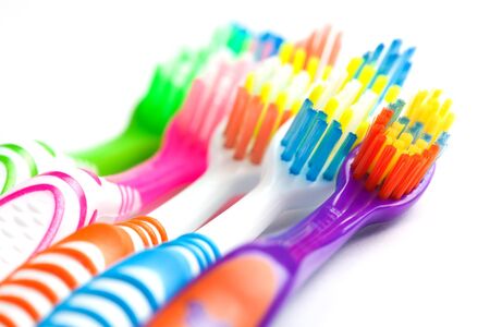 set of multicolored toothbrushes isolated on whiteの写真素材