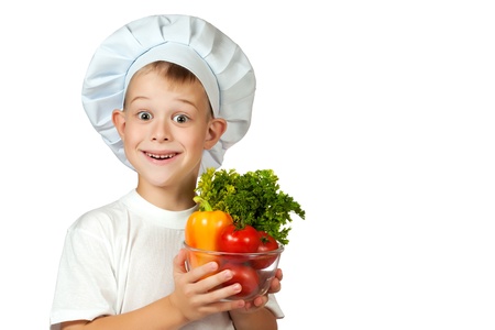 cook boy Chef is holding fresh vegetablesの写真素材