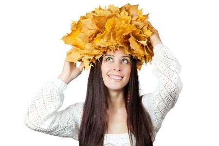 cheerful girl with yellow autumn leafs  isolatedの写真素材