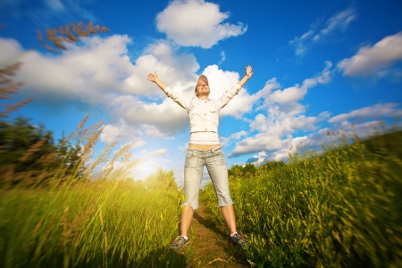 happy girl over the blue skyの写真素材