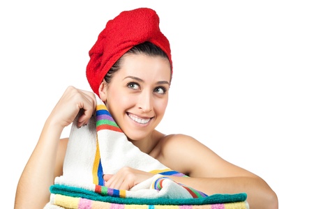 young beautiful girl with rad towel on her headの写真素材