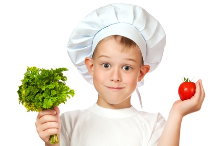 cute boy Chef is smiling  raw vegetablesの写真素材