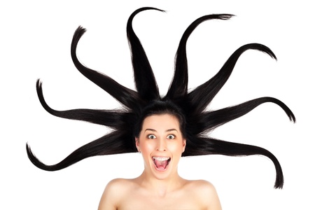 Young woman with long splayed hair  isolatedの写真素材