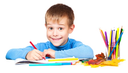 happy kid is drawing with pencilsの写真素材
