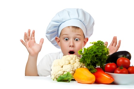 surprised cute scullion with raw vegetablesの写真素材