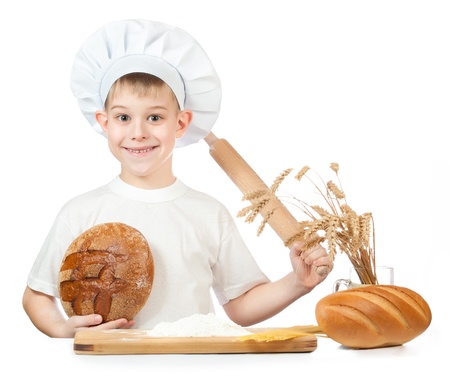 funny little baker is kneading doughの写真素材