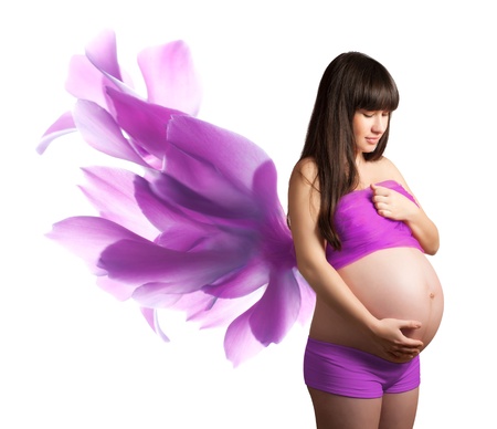 Pregnant woman with pink petals  isolatedの写真素材