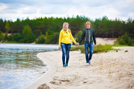 couple are walking on the beachの写真素材