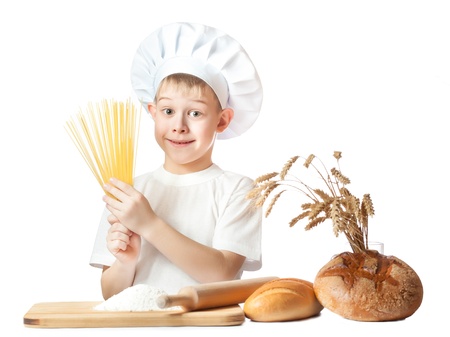 little master chef with spaghetti in his handsの写真素材