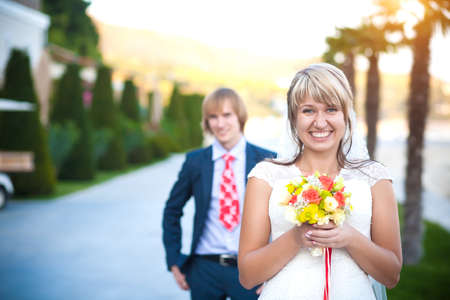 happy couple in a sunny tropical  parkの写真素材