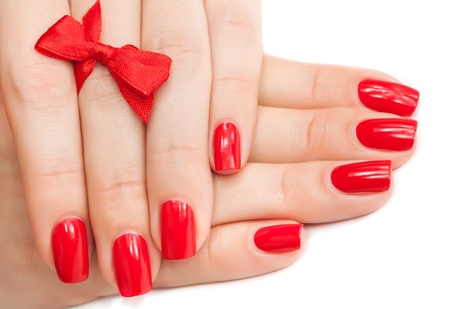 Hands with red manicure isolatedの写真素材