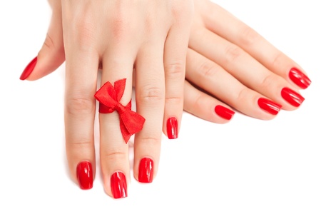  red manicure with a bow isolatedの写真素材