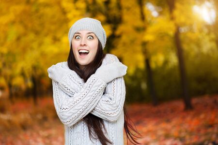 woman on a background of autumn treesの写真素材