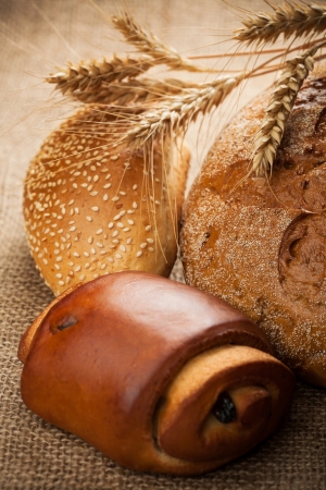 assortment of baked bread on burlapの写真素材
