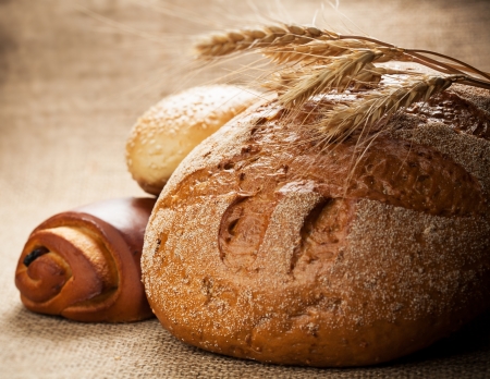 assortment of baked bread on burlapの写真素材