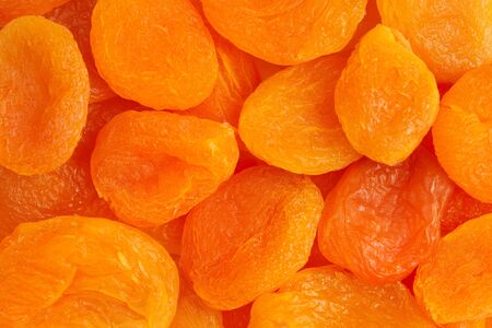 Heap of dried apricots close-up.の写真素材