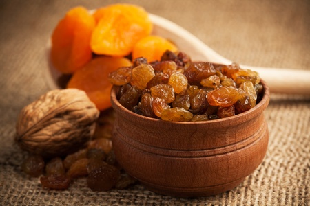 dried fruit on a wooden spoonの写真素材