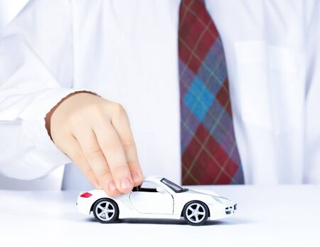 boy s hand with white toy carの写真素材