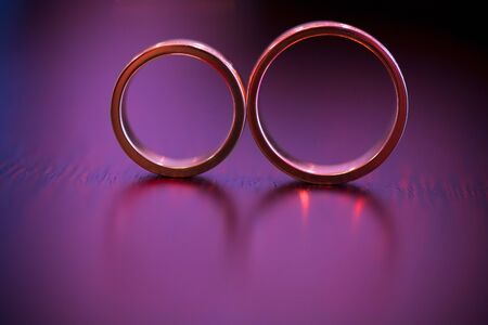 beautiful golden rings on the tableの写真素材