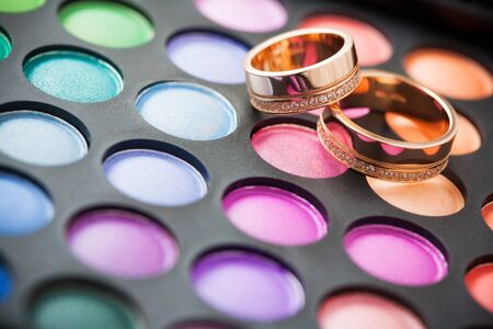 makeup kit for eyes and wedding ringsの写真素材