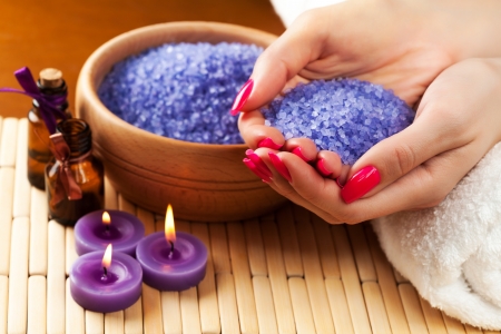 female hands with aromatic candles and towel  Spaの写真素材