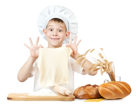 funny little baker is kneading doughの写真素材