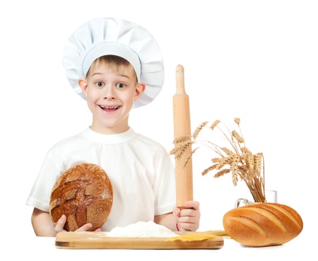little baker boy with a loaf of rye bread and rolling pinの写真素材