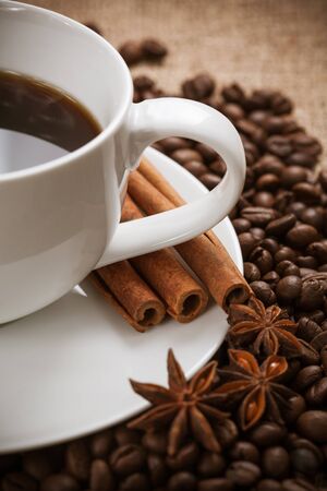 white cup of aromatic coffee with cinnamonの写真素材